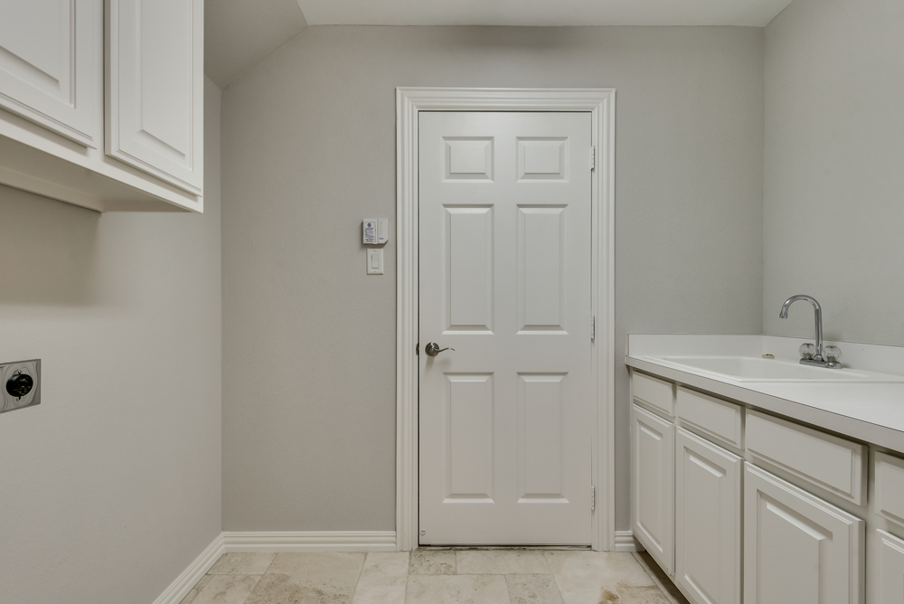    Main Level Utility Room with Sink and Built In Cabinetry 