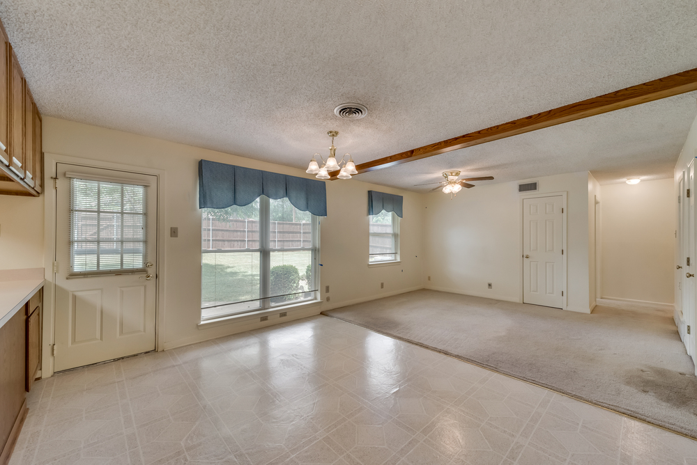    Dining Area includes Wood Ceiling Beam and Backyard Views 