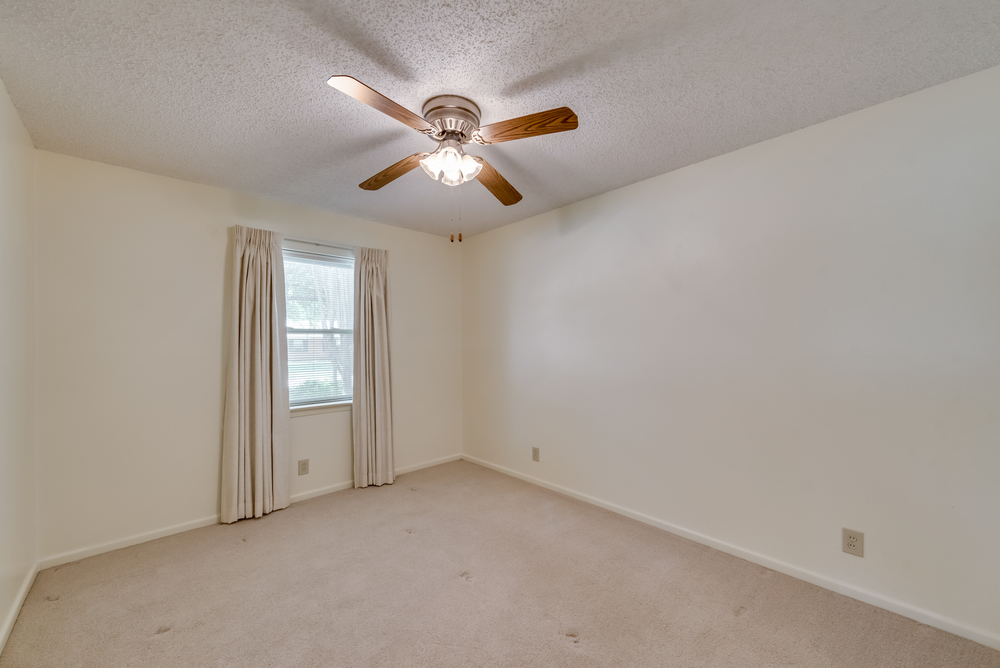    Secondary Bedroom one with Ceiling Fan and Closet 