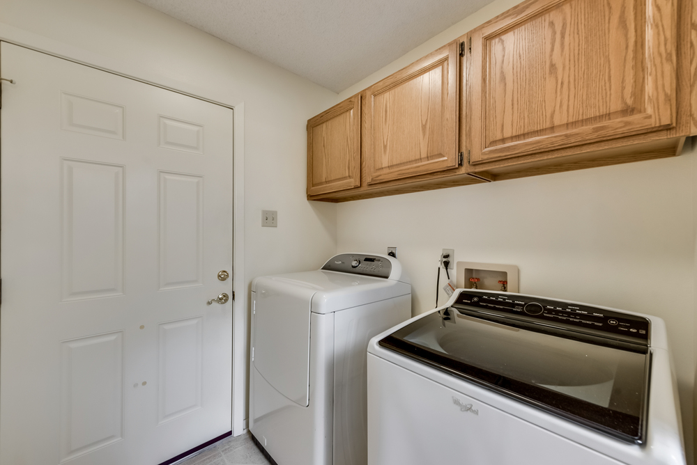    Utility Room features Built in Cabinetry and Walk in Pantry for Additional Storage 