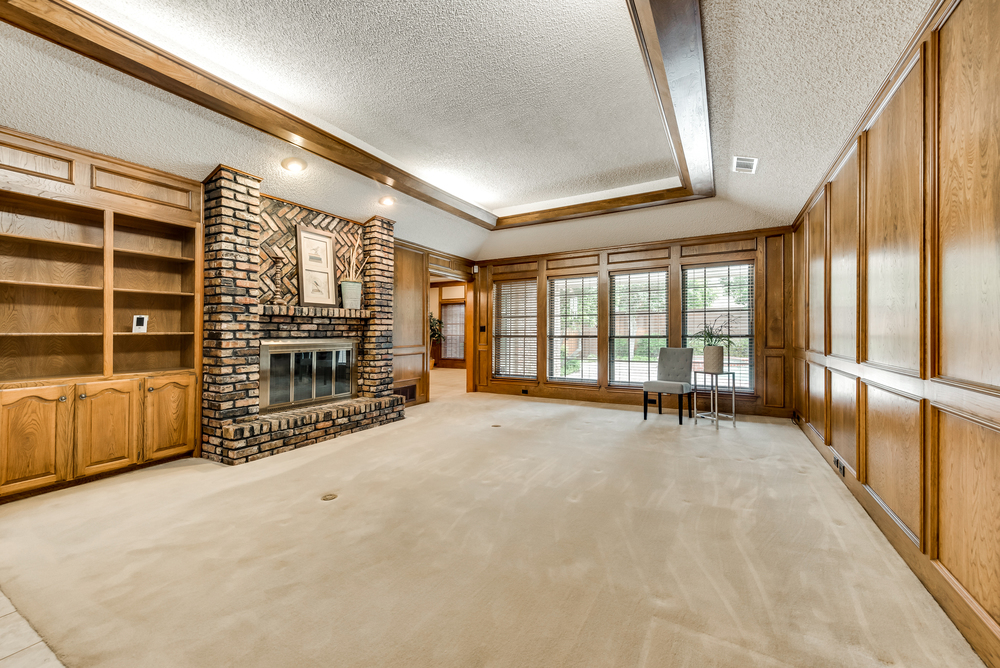    Family Room with Brick Fireplace and Built In Cabinetry 
