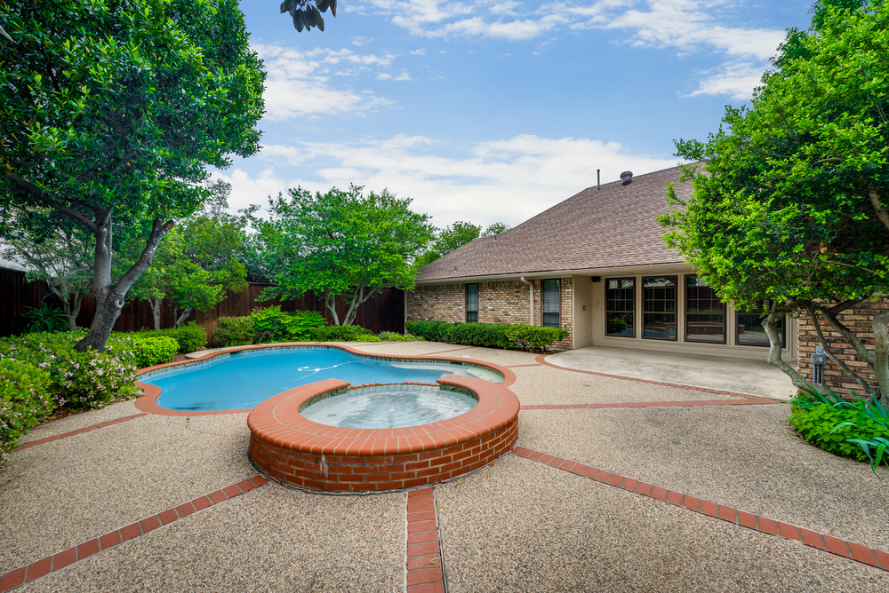    Tranquil Backyard with Trees and Lush Landscaping 