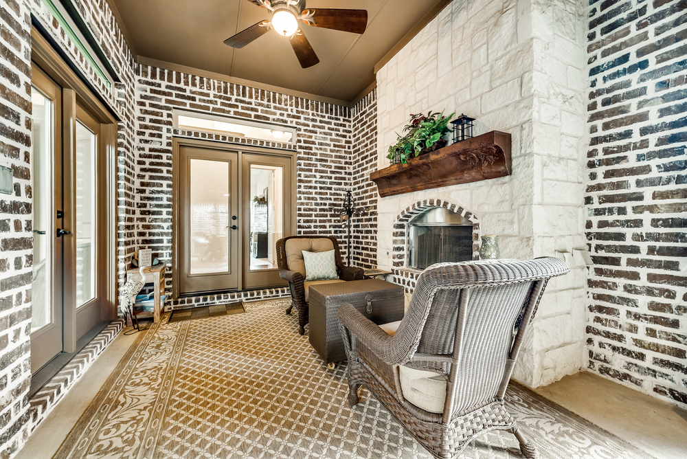    Al fresco Room with Roll Down Screen and Stone Fireplace 