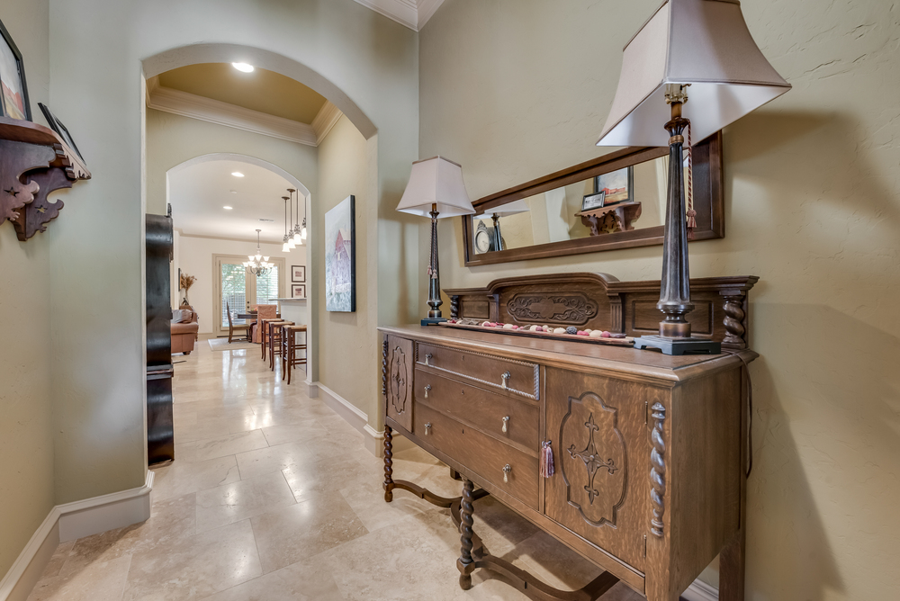    Travertine Floors Stretch from Entry through Main Living Areas 