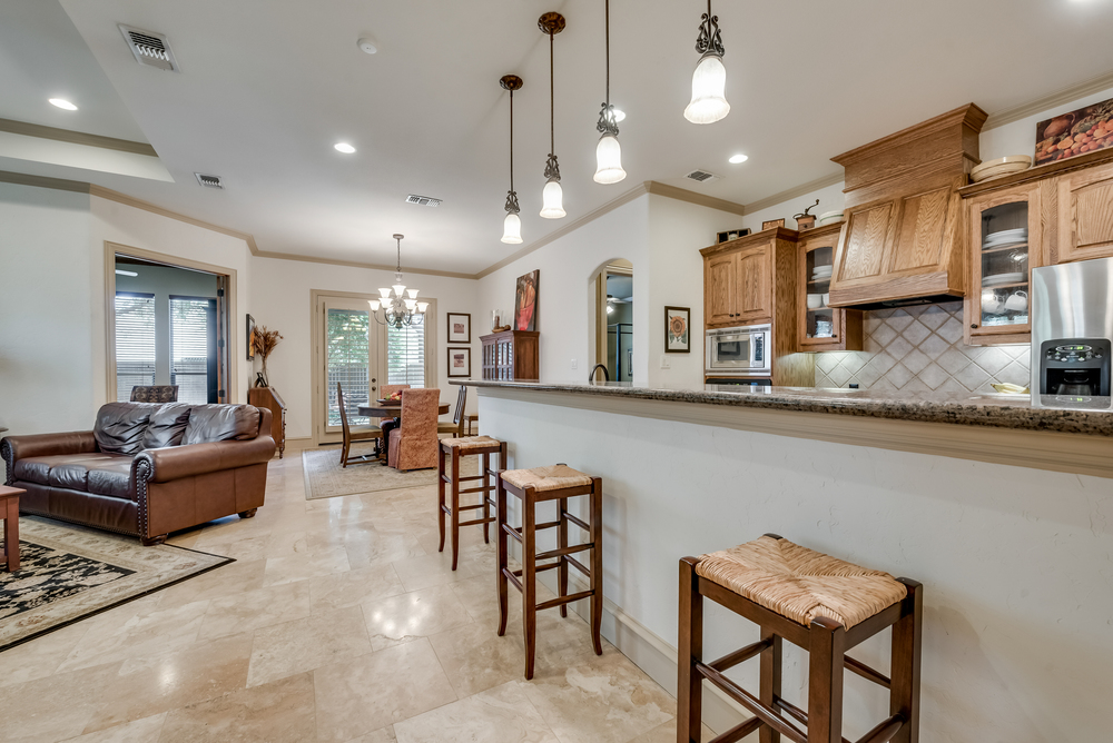    Gourmet Kitchen features Breakfast Bar with Pendant Lights 