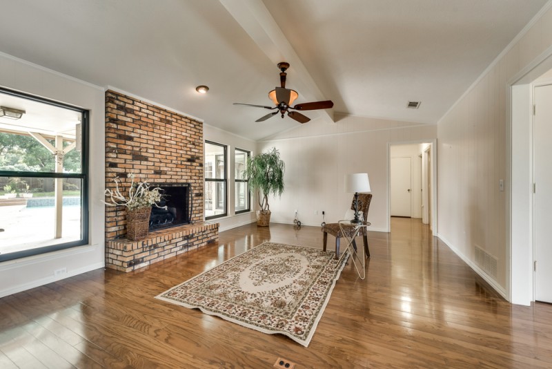    Inviting Family Room with Brick Gas Log Fireplace 
