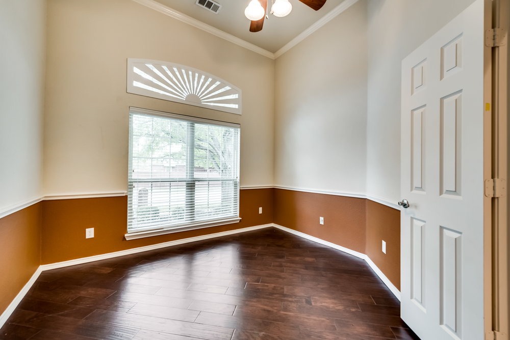    Study with french doors hardwoods and crown and chair molding 