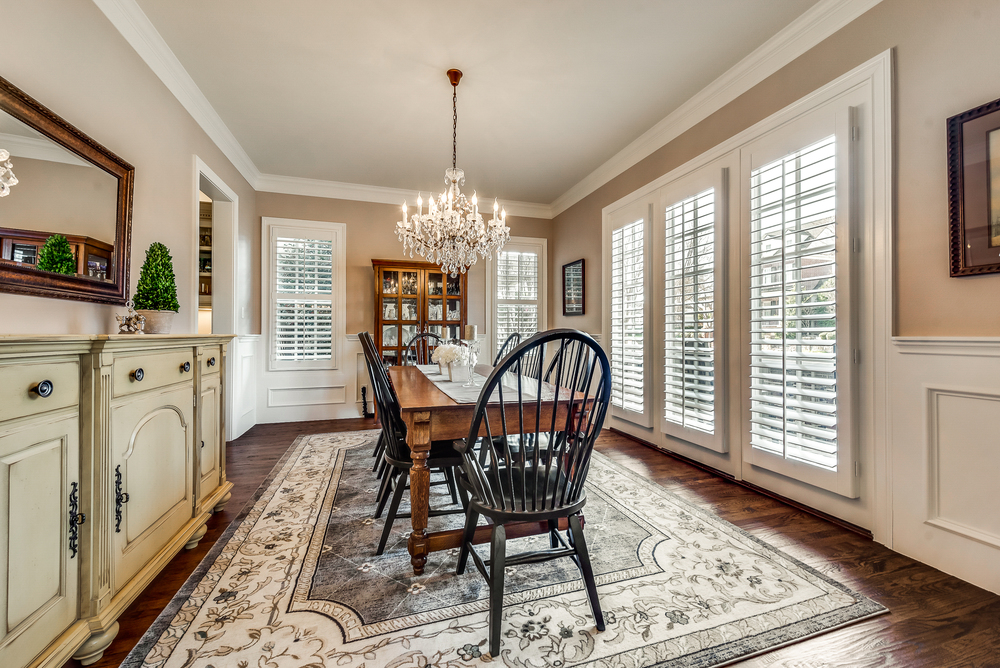    Formal Dining with Plantation Shutters and Stunning Crystal Chandelier 