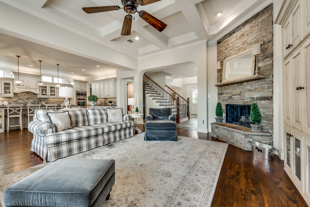    Inviting Family Room with Coffered Ceilings and Stone Gas Log Fireplace 