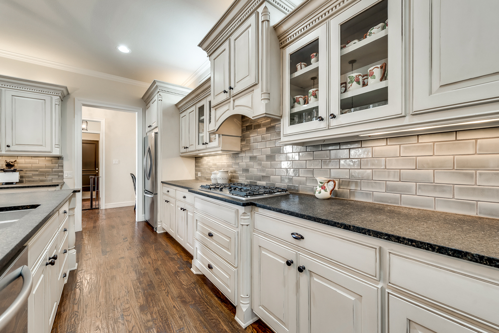    Stainless Steel Appliances Include with   Burner Gas Cooktop and Double Ovens 