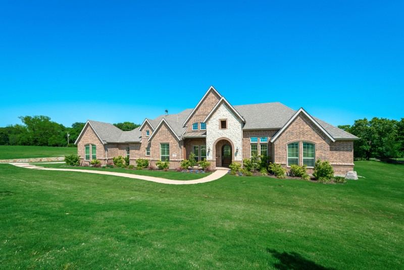    Amazing Curb Appeal with Lush Landscaping and Front Porch 