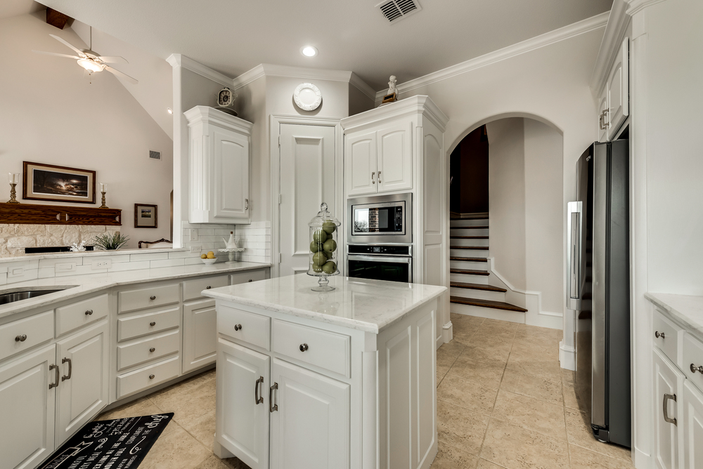    Subway Tile Backsplash and Gorgeous White Cabinetry with Pulls 