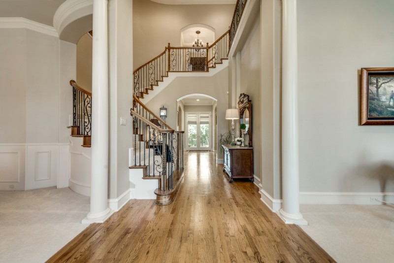    Soaring Entry with Spiral Wrought Iron Staircase 