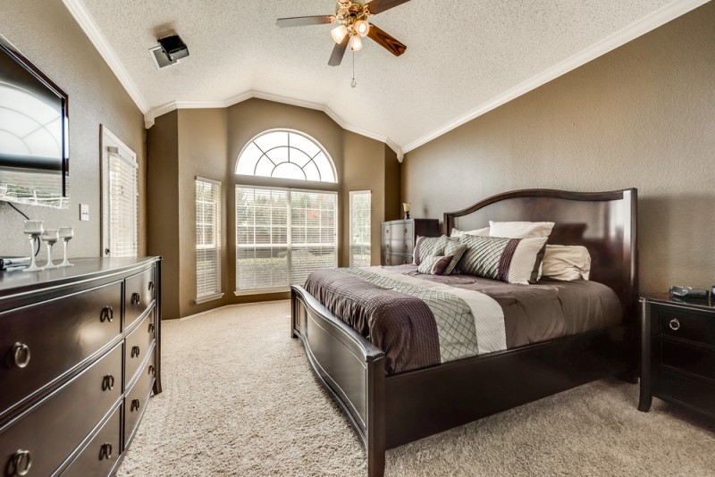    Private Mater Suite with Vaulted Ceiling and Door to Patio 