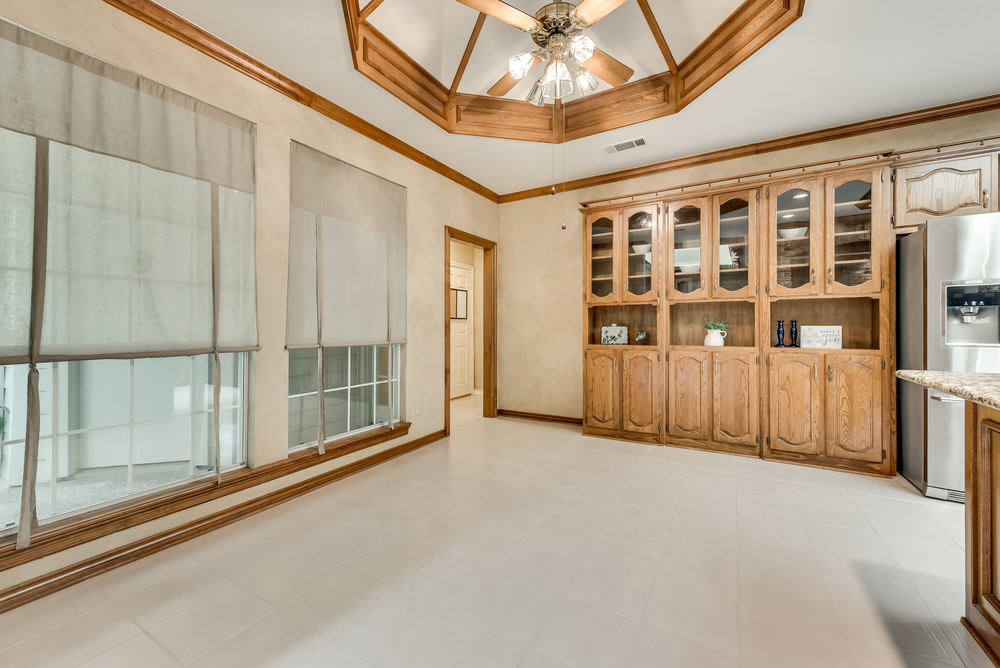    Charming Breakfast Area has Built In Hutch with Glass Detail Doors and Beautiful Ceiling 