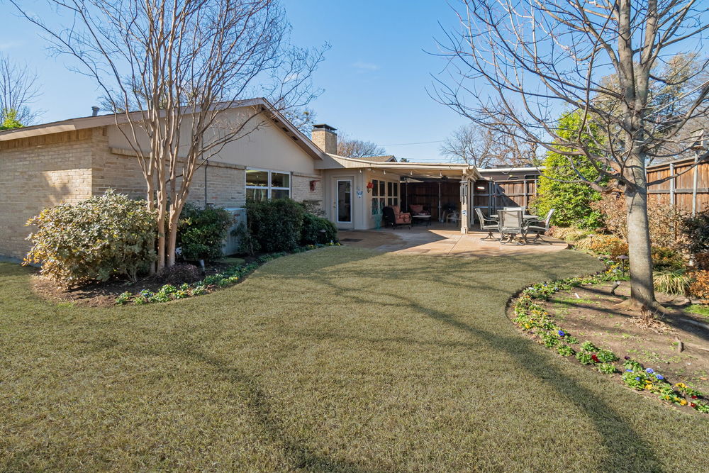    Backyard Oasis with Lush Landscaping and Mature Trees 
