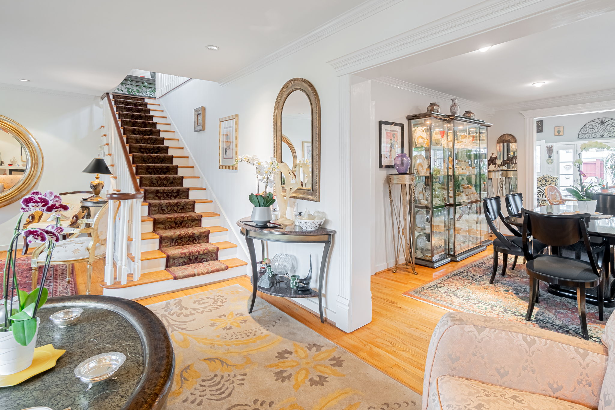    Wooden Stairs with Carpet Runner and Beautiful Millwork Through Out 
