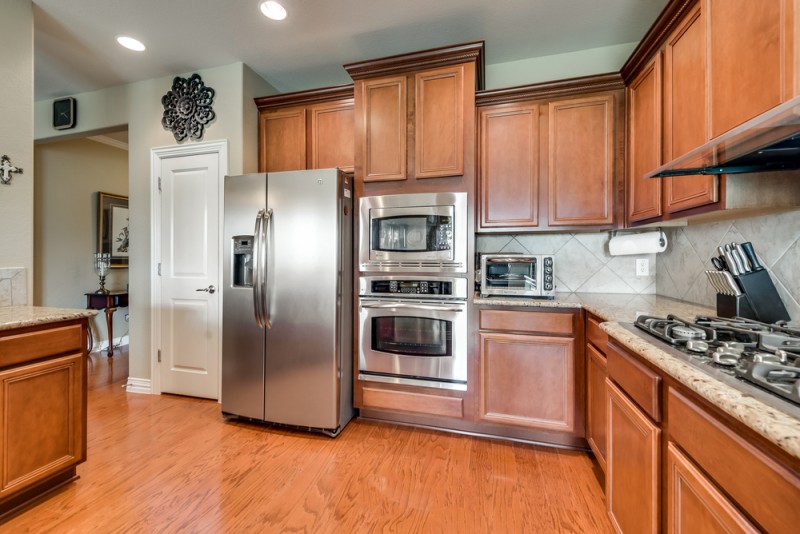   Gourmet Kitchen with Stainless Steel Appliances and Granite Countertops 
