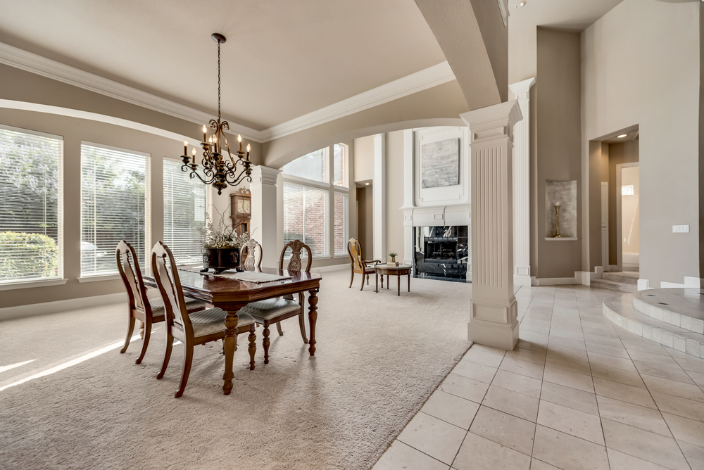    Elegant Formal has Chic Chandelier while Formal Living has Gas Log Fireplace with Rich Millwork 