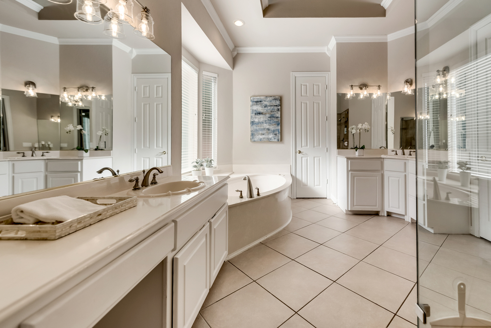   Spa Like Master Bath with Separate Vanities Jetted Tub and Walk In Closet 
