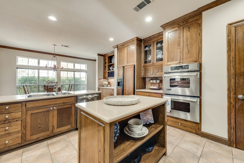    Abundance of Cabinetry Inset Built In Refrigerator and Double Jenn Air Ovens 