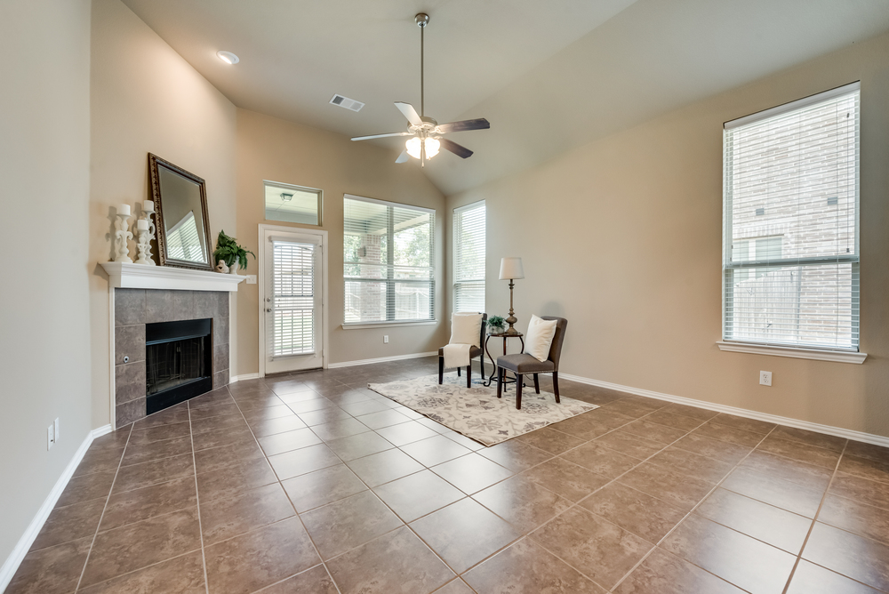    Family Room with with Gas Fireplace and Wooden Mantel 