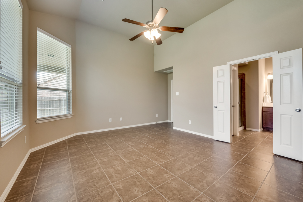    Private Master Suite with Wall of Windows and Backyard View 