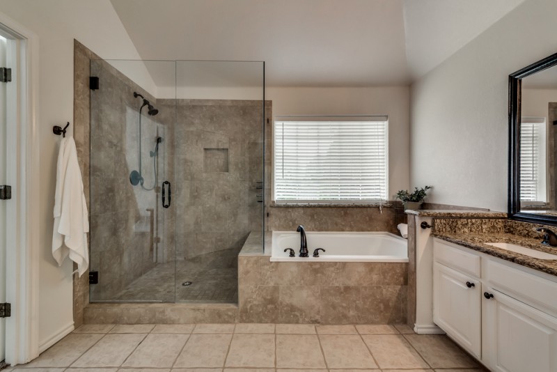    Master Bath with Seamless Glass Shower and Soaker Tub 