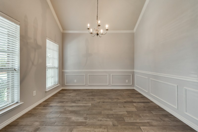    Formal Dining with Arched Doorways and Molding 