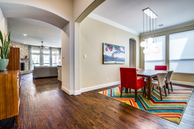    Elegant Formal Dining features Stunning Light Fixture 