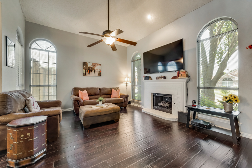    Family Room features Brick Gas Log Fireplace and Great Natural Light   
