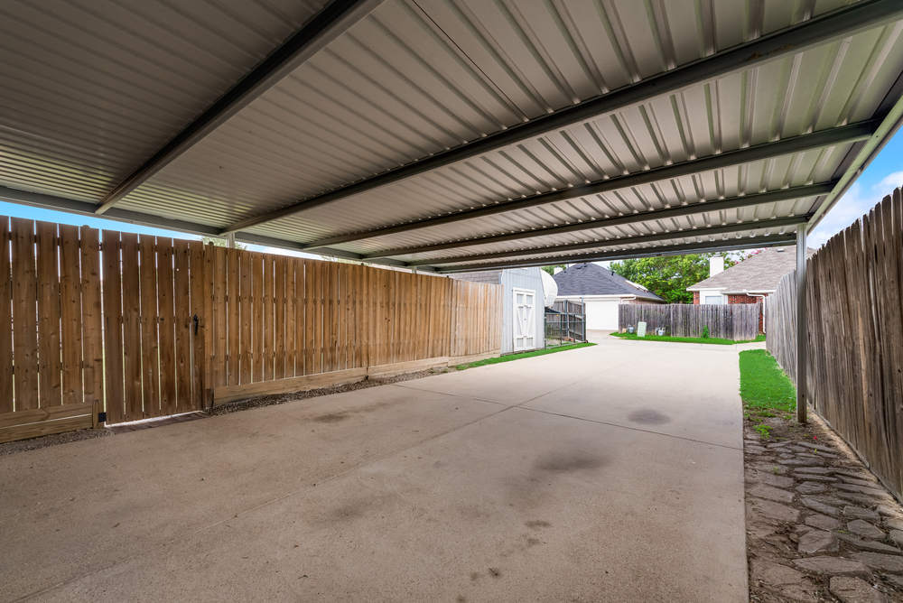    Rear Carport out to Storage Shed and Extended Driveway 