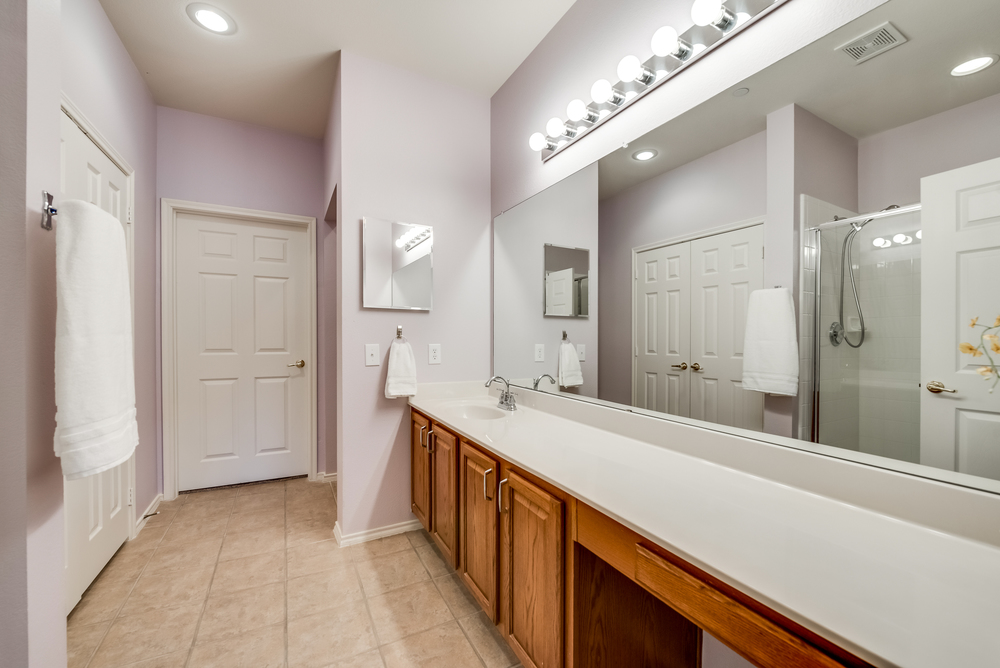    Master Bathroom with Long Vanity Separate Shower Walk In Closets 
