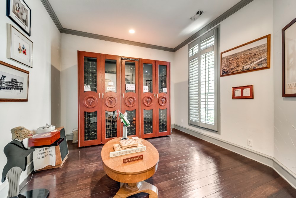    Study Features French Doors Crown Molding and Plantation Shutters 