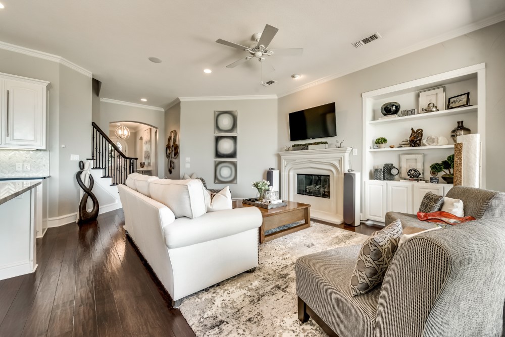    Family Room Features Built in Shelving and Cast Stone Gas Fireplace 