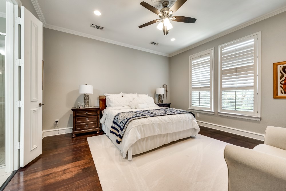    Master Suite with Recessed Lighting and Plantation Shutters 