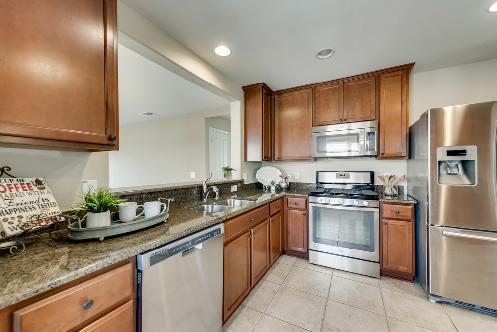    Chef s Kitchen with Granite Countertops and Stainless Steel Appliances 