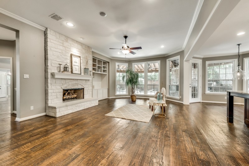    Inviting Family Room with Stone Fireplace and Built In Entertainment Center 