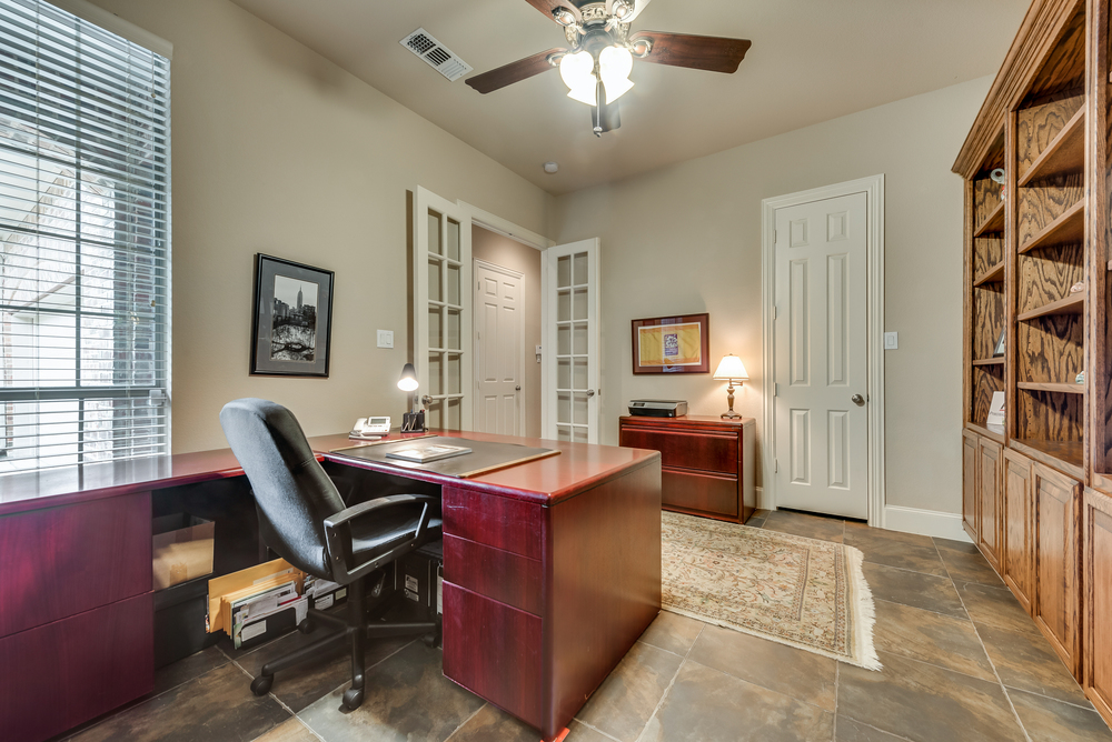    Study with Wall of Rich Built Ins and Walk In Closet 