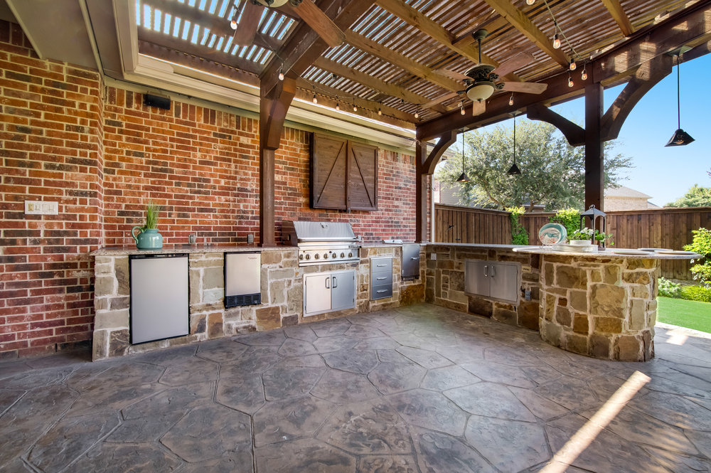    Outdoor Kitchen with Gas Grill BBQ Smoker Refrigerator and Granite Countertops 