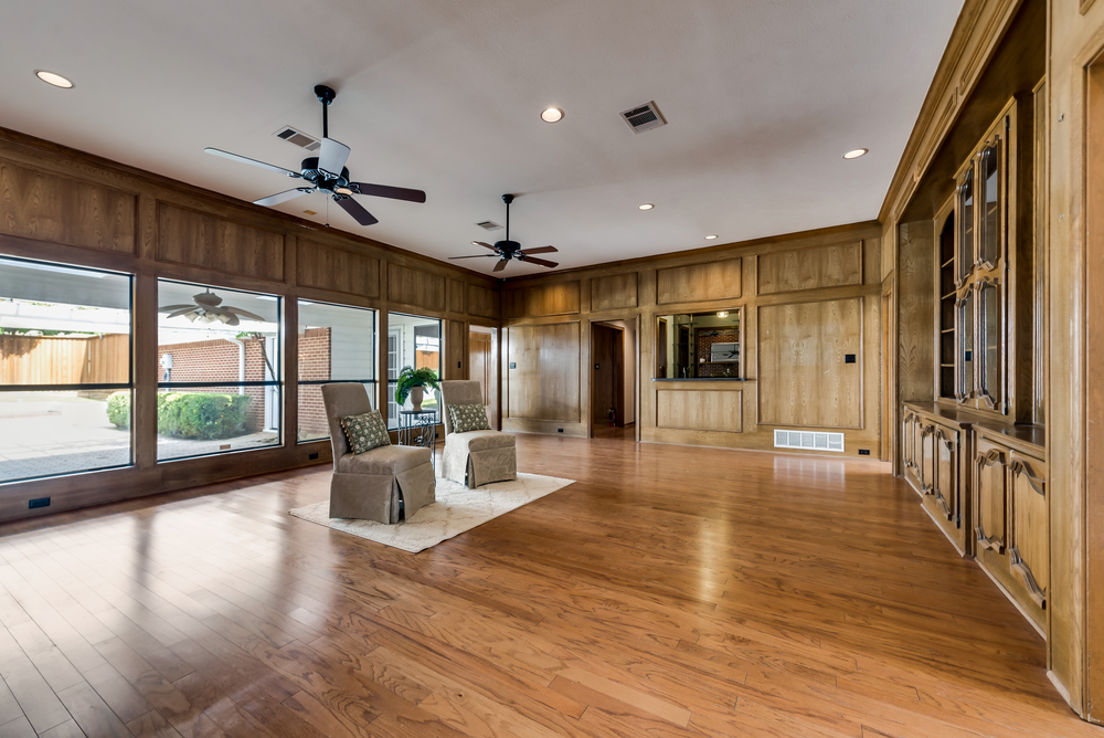    Spacious Family Room has Wall of Paneless Windows looking out to Covered Patio 